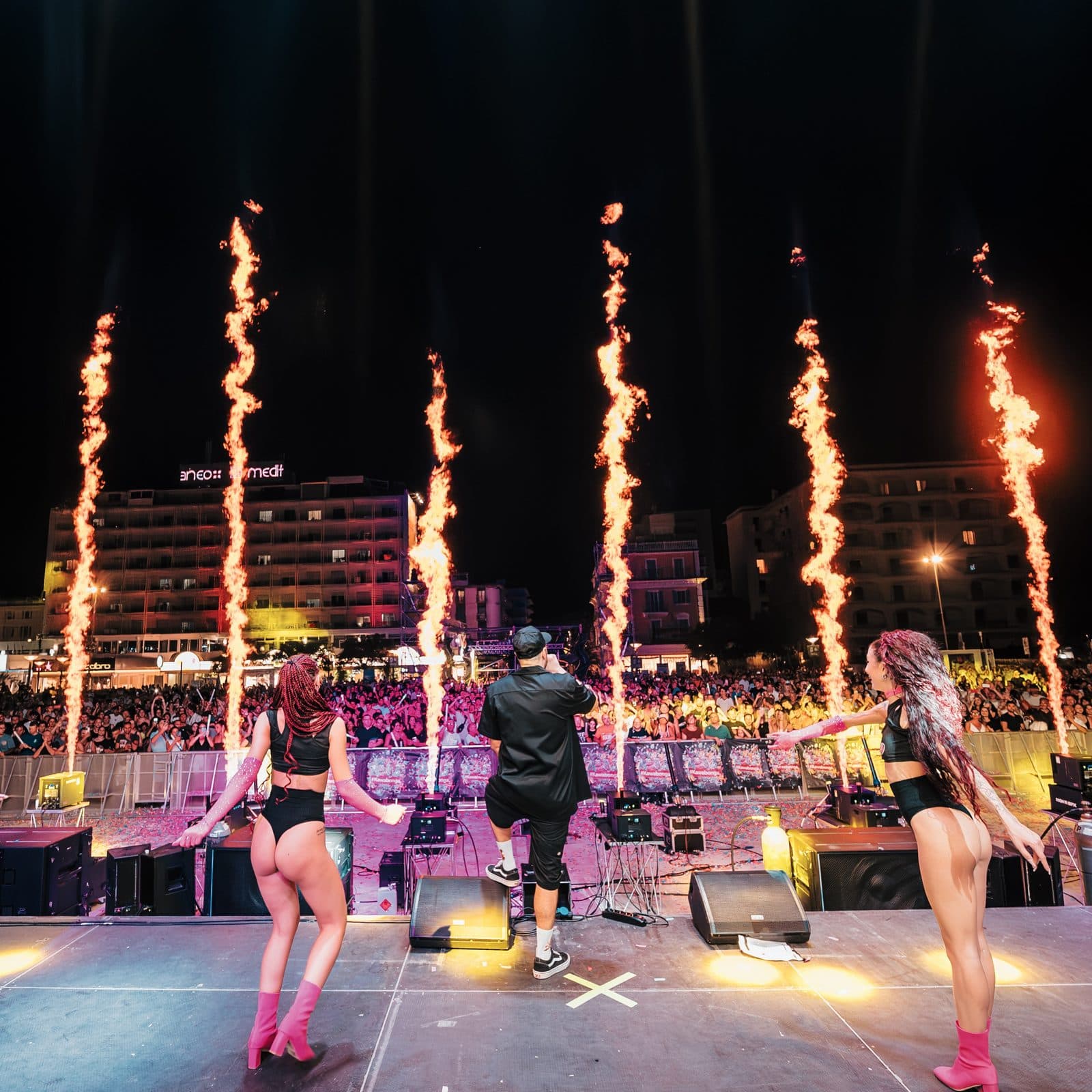 Columns of fire on stage with dancers